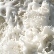 © chartchai - Soft Fluffy Ocean Wave Foam Texture In Close Up View With Splashing White Seafoam And Airy Bubbles
