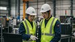 © RNata - Professional asian male factory worker wearing safety hat and vest portrait in modern industrial manufacturing plant background.