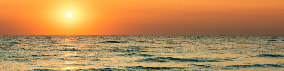 Wall Mural - seascape in the early morning. beautiful rose sunrise over the sea. horizontal banner
