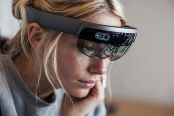 Poster - A woman wearing a pair of virtual reality goggles