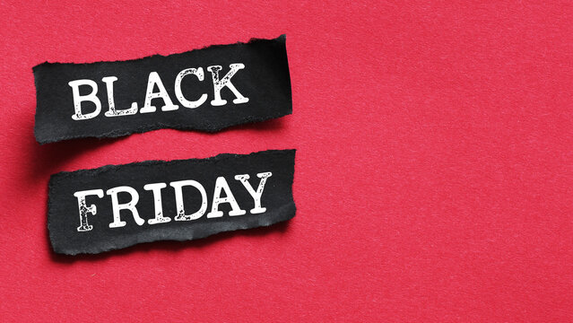 Black Friday words written on a piece of paper. Time for promotions and sales in stores.