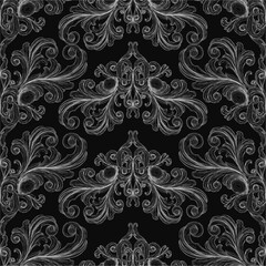 Poster - A black and white floral pattern decorates a dark background with intricate details and varied shapes. The ornamental design features delicate curves and contrasting tones for a striking visual.