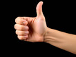 © Morning Dew - Ai generated image of a hand giving a thumbs up gesture on a black background