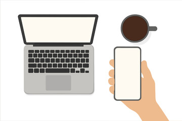 Fototapete - Top View Workspace with Laptop, Smartphone in Hand, Coffee Cup. Blank Screen Copy Space. Modern Office Desk for Business, Management, IT, Remote Work, Communication, Technology Concept