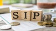 © N7 - Soft focus image of SIP letters on wooden cubes representing systematic investment strategy