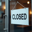 © Yana Sh - Realistic image of a 'Closed' sign on glass cafe doors, symbolizing a closed shop or small business. Perfect for business or retail themes