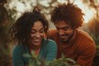 © stockphoto02 - Happy couple smiling together while looking at plants, enjoying nature's beauty.