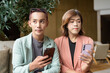 © Ranta Images - Transgender and non-binary coworkers working remotely in cafe