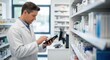 © DigitalSpace - Pharmacist conducting stock check with handheld digital tool in dispensary.