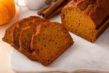 Wall Mural - Pumpkin bread freshly baked sliced on a serving board, Thanksgiving dessert