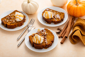 Wall Mural - Pumpkin bread freshly baked topped with whipped cream, Thanksgiving dessert