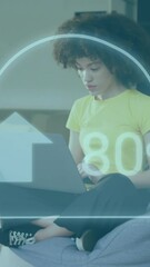 Poster - Animation of cloud with percent growing over african american businesswoman using laptop