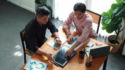 Poster - Top view of business team working together to analysis data by using tablet on meeting table. Diverse creative people discussing and brainstorming plan while looking at financial graph. Convocation.
