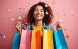 © fu - Joyful happy Woman Shopping. Shopping bags and confetti on a studio background. Concept of Shopping, Retail, Sale, Black Friday or Cyber Monday. High quality