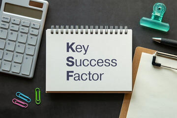 Poster - There is notebook with the word Key Success Factor. It is as an eye-catching image.