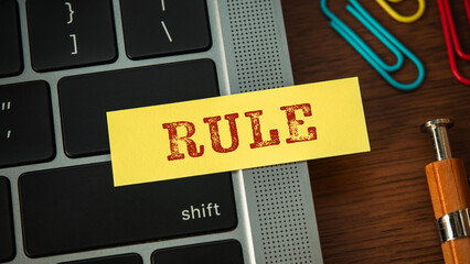 Poster - There is sticky note with the word RULE. It is as an eye-catching image.