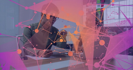 Poster - Collaborating Asian man and white woman using laptop in office meeting area wearing business casual