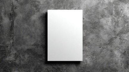 Poster - A blank, white rectangular object sits on a textured, gray surface, providing a clean, minimalist backdrop suitable for various design applications
