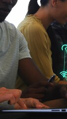 Poster - Animation of connected icons forming globes over diverse coworkers discussing reports on laptop