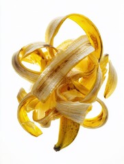 Poster - Unique Abstract Composition Featuring Intertwined Banana Peels on a Clean White Background Showcasing Vibrant Colors and Textures