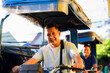 © Mdv Edwards - Friendly Filipino Tricycle Drivers, smiling warmly while waiting for passengers. A typical scene in Metro Manila, Philippines.
