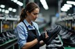 © starush - Woman inspecting black leather shoe in footwear store
