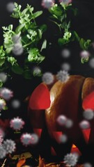 Poster - Animation of halloween pumpkins with multiple covid 19 cells floating on black background