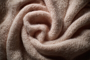 Aufkleber - Soft beige organic cotton cloth gently draped in spiral shape, showcasing cozy texture and delicate fibers, creating warm and inviting atmosphere