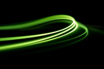 Poster - Dynamic Green Light Trails on Black Background