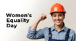 © Elegant Collections - Empowered woman in construction gear flexing her bicep celebrating women s equality day with a strong confident smile