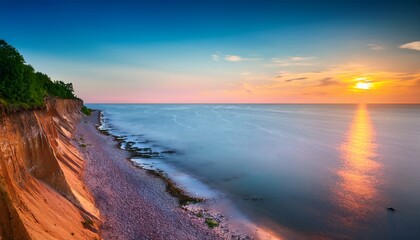 Wall Mural - cliff on sea shore at sunrise baltic sea long exposure photo