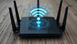© Murtaza - Elegant black Wi-Fi router resting on a natural wood grain surface, with a glowing signal icon pulsing gently above it, encircled by digital network symbols, emphasizing the digita