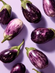 Poster - Clean Studio Shot Featuring Vibrant Eggplants Arranged Among Abstract Shapes in a Minimalist Setting