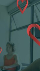 Poster - Animation of falling hearts over caucasian woman using vr headset