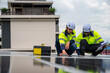 © Jack Tamrong - Diversity photovoltaic engineers working on solar panels roof