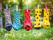 © apparel - Colorful Socks Hanging on Clothesline Outdoors