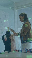 Aufkleber - Animation of connected icons and numbers over woman examining design of dress in office