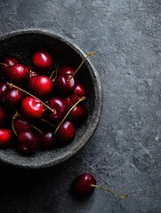 Poster - Cherry Bowl Filled With Fresh Cherries on Textured Dark Surface Ready for Summer Snacking and Cooking