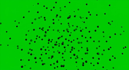 Poster - Scattered dark spheres on vibrant green background creating a dynamic and abstract composition view