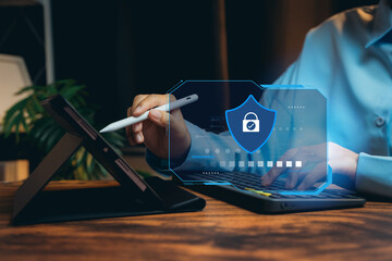 Poster - Digital security concept with shield icon, tablet and calculator, securing data connection and protection in modern workspace environment