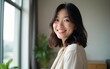 © zhao - Profile picture of smiling young Vietnamese woman show optimism leadership. Close up headshot portrait of happy millennial asian 20s female renter or tenant pose look at camera in own flat apartment.