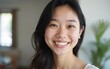 © zhao - Profile picture of smiling young Vietnamese woman show optimism leadership. Close up headshot portrait of happy millennial asian 20s female renter or tenant pose look at camera in own flat apartment.