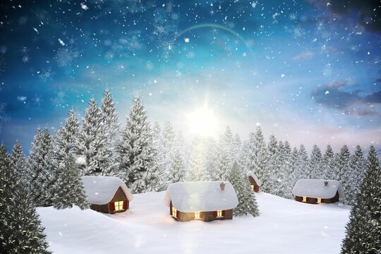Snow covered village in forest
