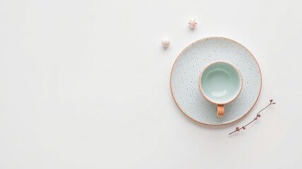 Poster - Minimalist composition featuring delicate ceramic cup and plate with pastel colors on a clean, white background