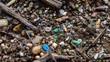 © CStock - Close-up view of soil mixed with colorful microplastics and natural debris, highlighting environmental pollution.
