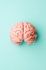 Poster - Brain Model Displayed with Clear Eyeglasses on Light Blue Surface Representing Neural Networks and Artificial Inteligence