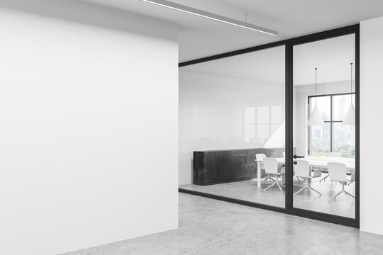 Empty white wall in modern office interior with glass meeting room for poster mockup or design presentation template concept in daylight setting. 3D Rendering