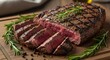 © Bruno Stock - A sliced grilled steak garnished with rosemary on a wooden cutting board close up