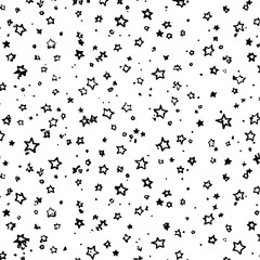 Poster - Seamless pattern of hand drawn black stars and dots scattered on a white background creating a night sky effect