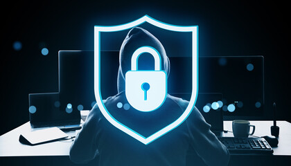 Fototapete - Cybersecurity concept with hooded figure behind glowing padlock shield icon symbolizing data protection and online privacy on dark tech background.